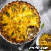 Easy South African bobotie in a white dish on a grey background.