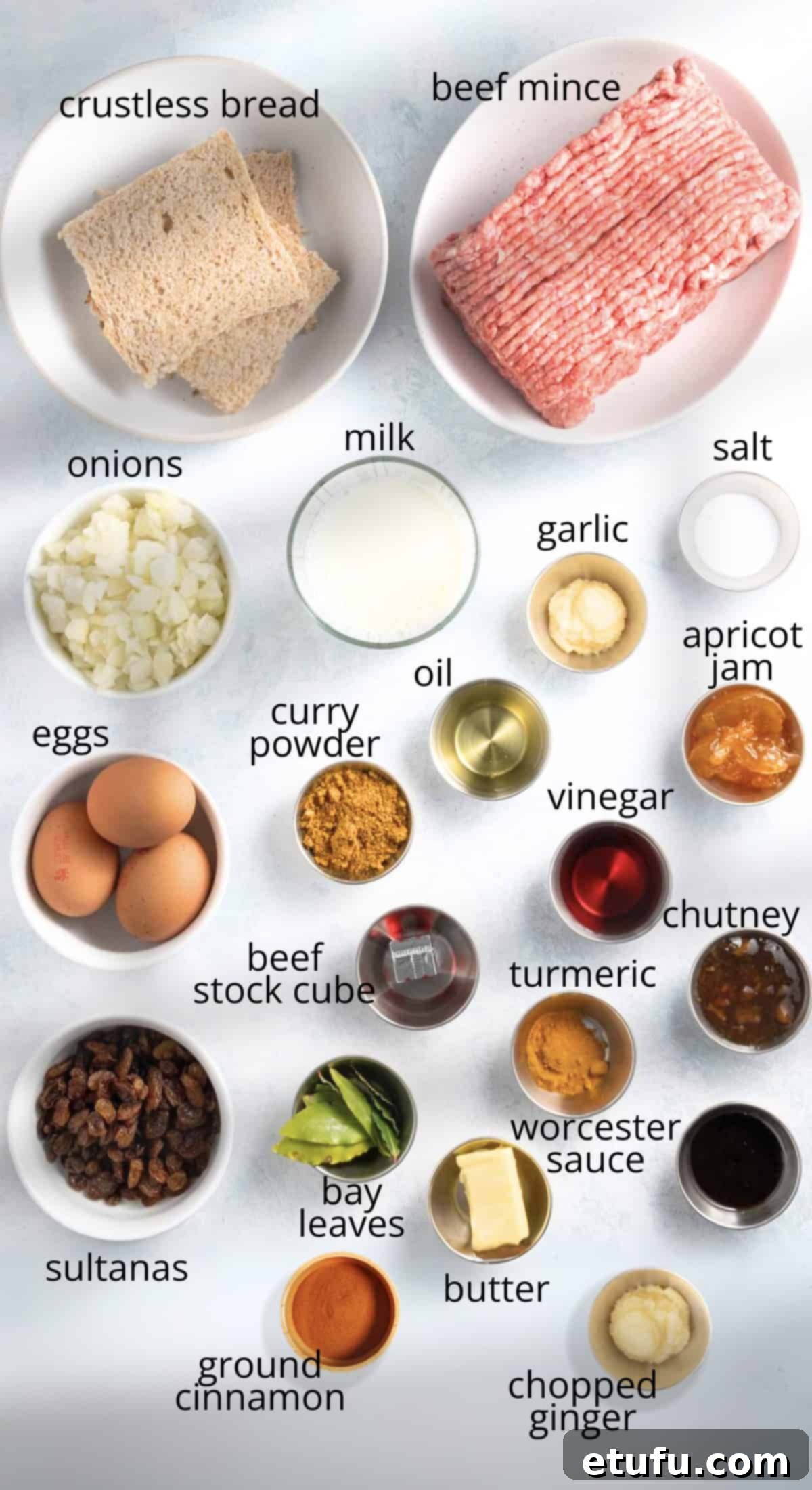 A vibrant display of fresh ingredients commonly used in South African bobotie.