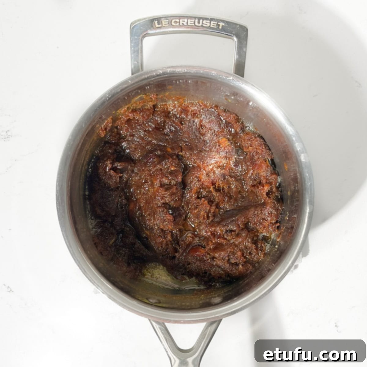 Effortless Date Bars 11 The date squares mixture, now including egg and sugar, being stirred in a saucepan.