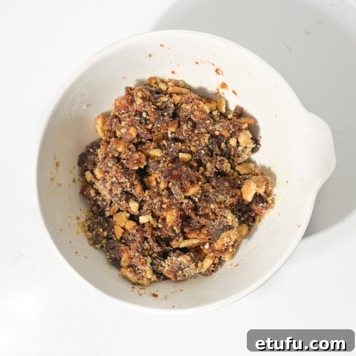 Effortless Date Bars 15 The combined date and biscuit mixture in a bowl, thoroughly mixed and ready for the pan.
