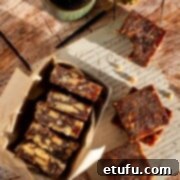 Effortless Date Bars 19 Date squares on a wooden background with a cup of coffee.