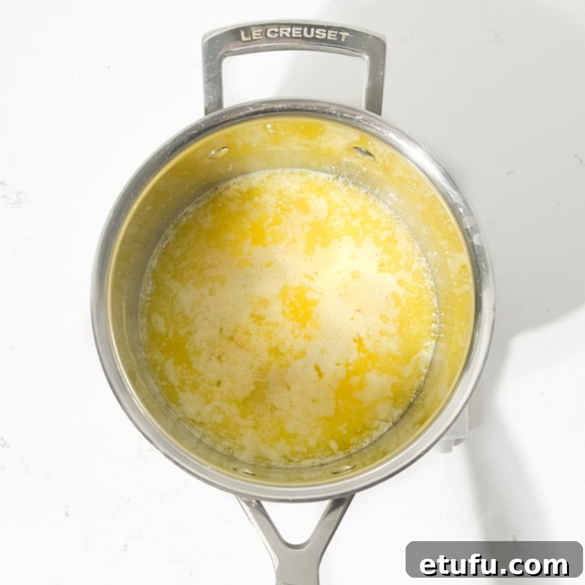 Effortless Date Bars 6 Melted butter shimmering in a saucepan over gentle heat.