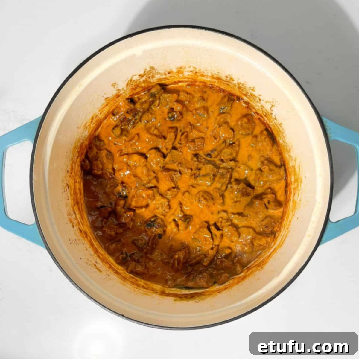 Completed beef curry with coconut milk in a large saucepan.