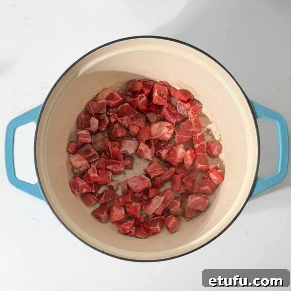Browning the meat for the beef curry in a large saucepan. 