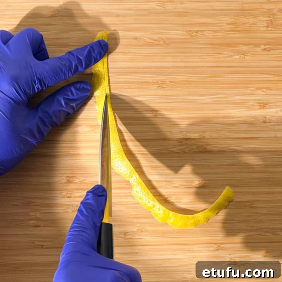 Slicing a long strip of lemon peel for the lemon peel twisty to go on the rock shandy glass.