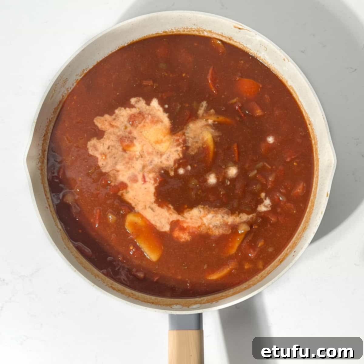 Ultimate Devilled Sausages 13 Adding the cornflour to the devilled sausages sauce.