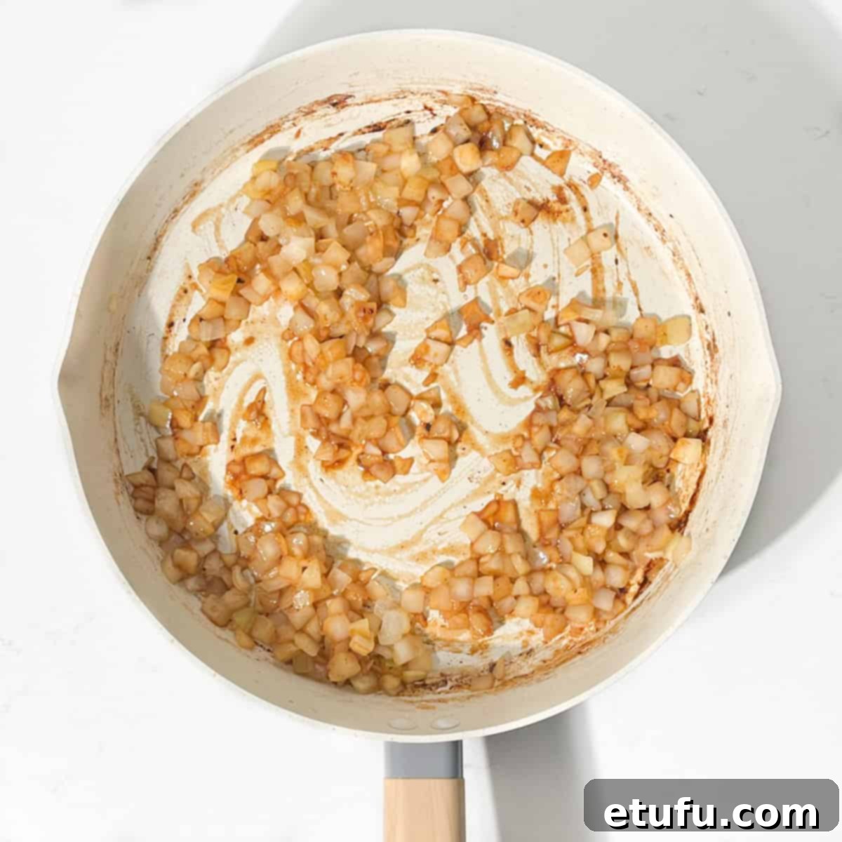 Ultimate Devilled Sausages 9 Browning the onions in a frying pan.