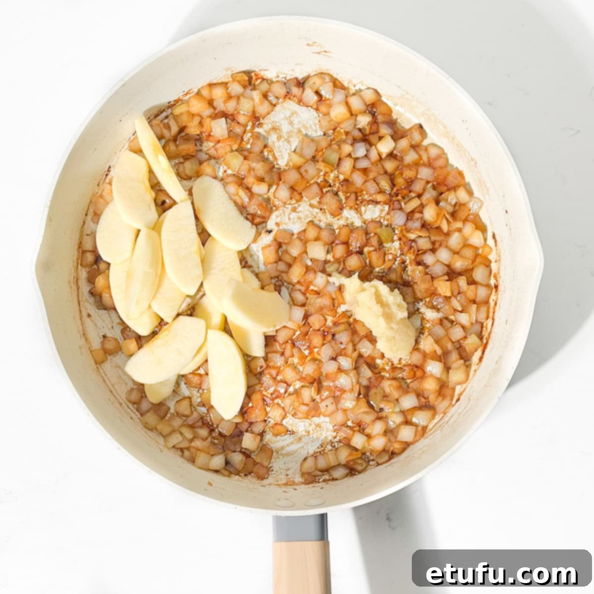 Ultimate Devilled Sausages 10 Frying the onions, apple and garlic together in a pan.