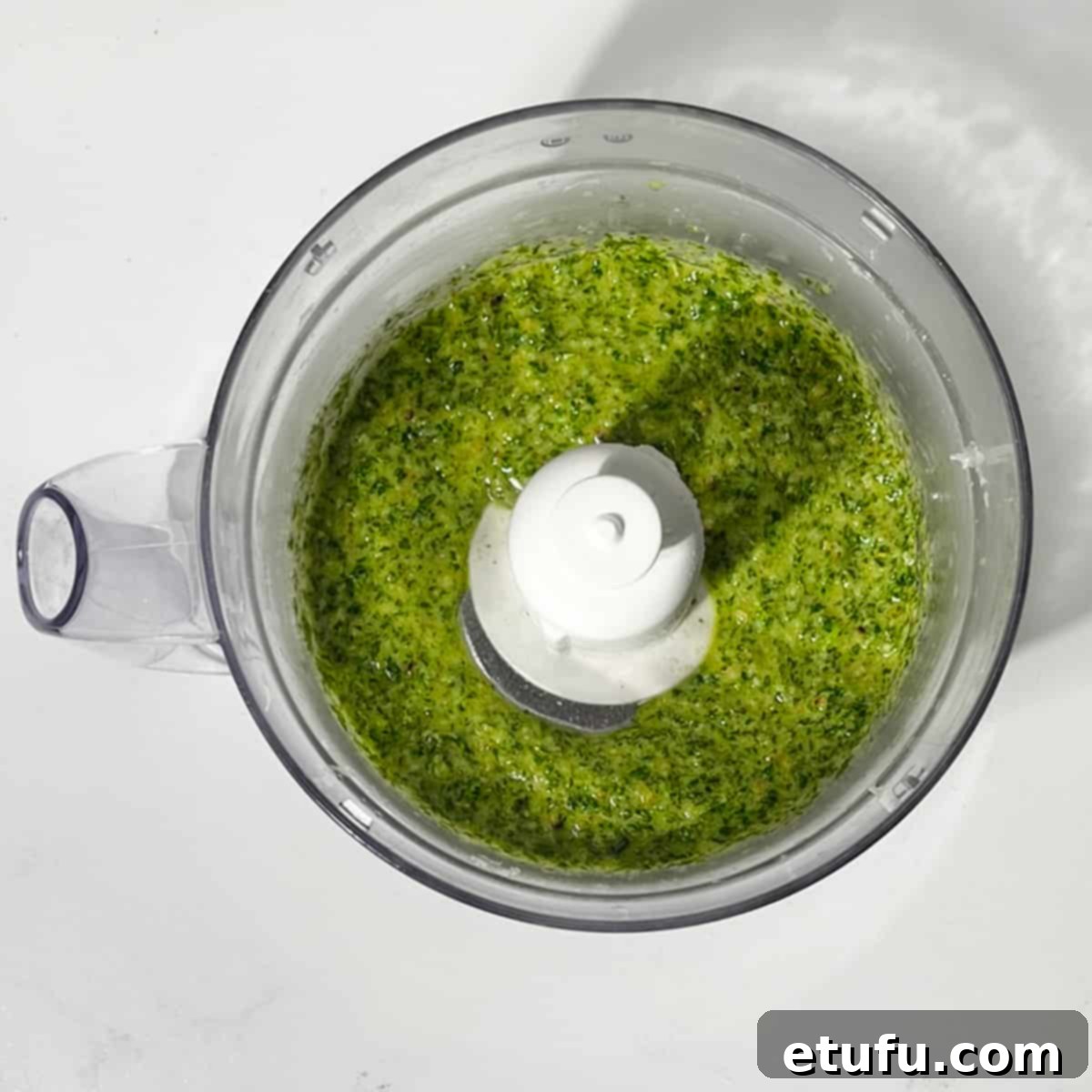Blended rocket pesto in a food processor.