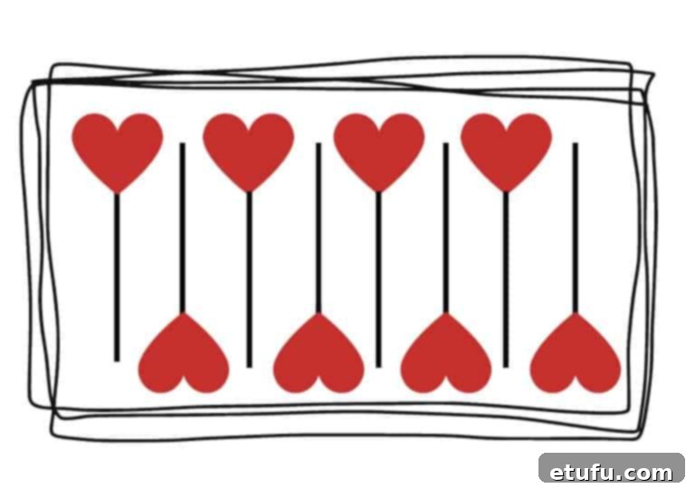 Pattern of cookies on a baking tray, one facing up, one facing down, repeating in this pattern.