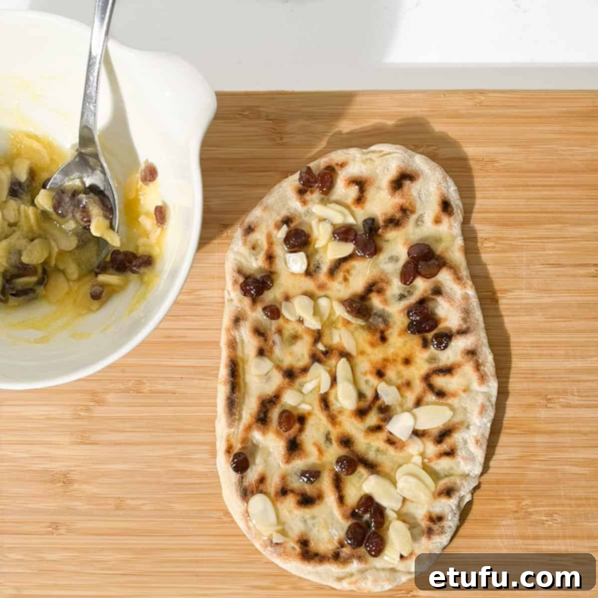 A freshly cooked Peshwari naan generously spread with the sweet glaze.