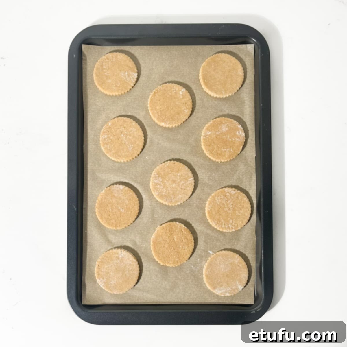 Cut out spice biscuits on baking tray.