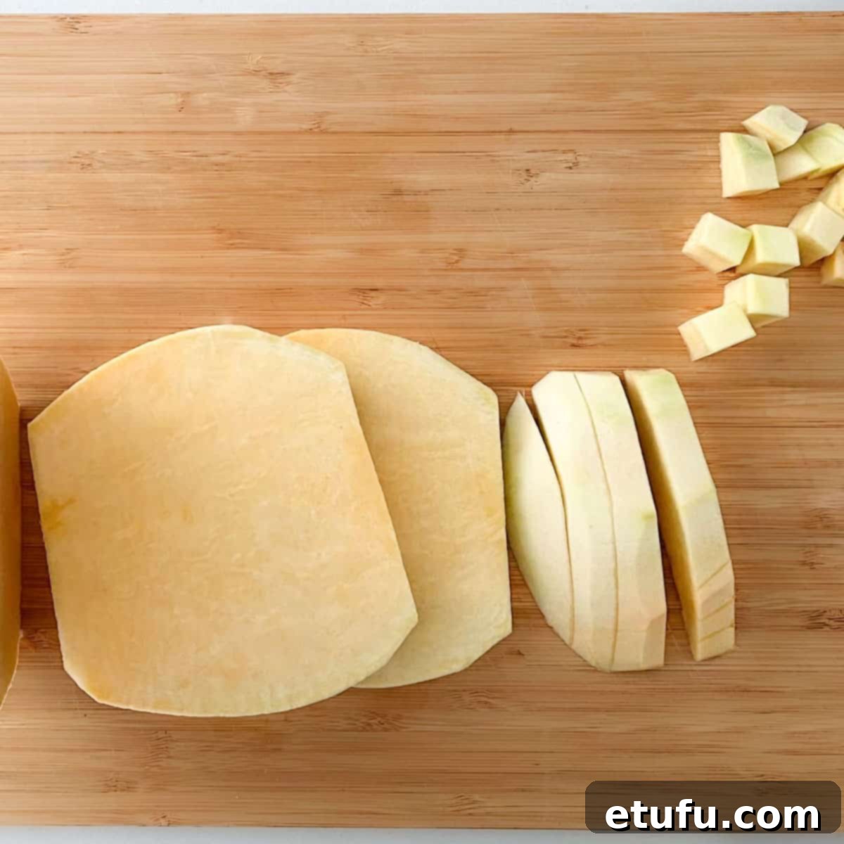 Creamy Carrot and Swede Mash 5 Sliced swede on a chopping board.