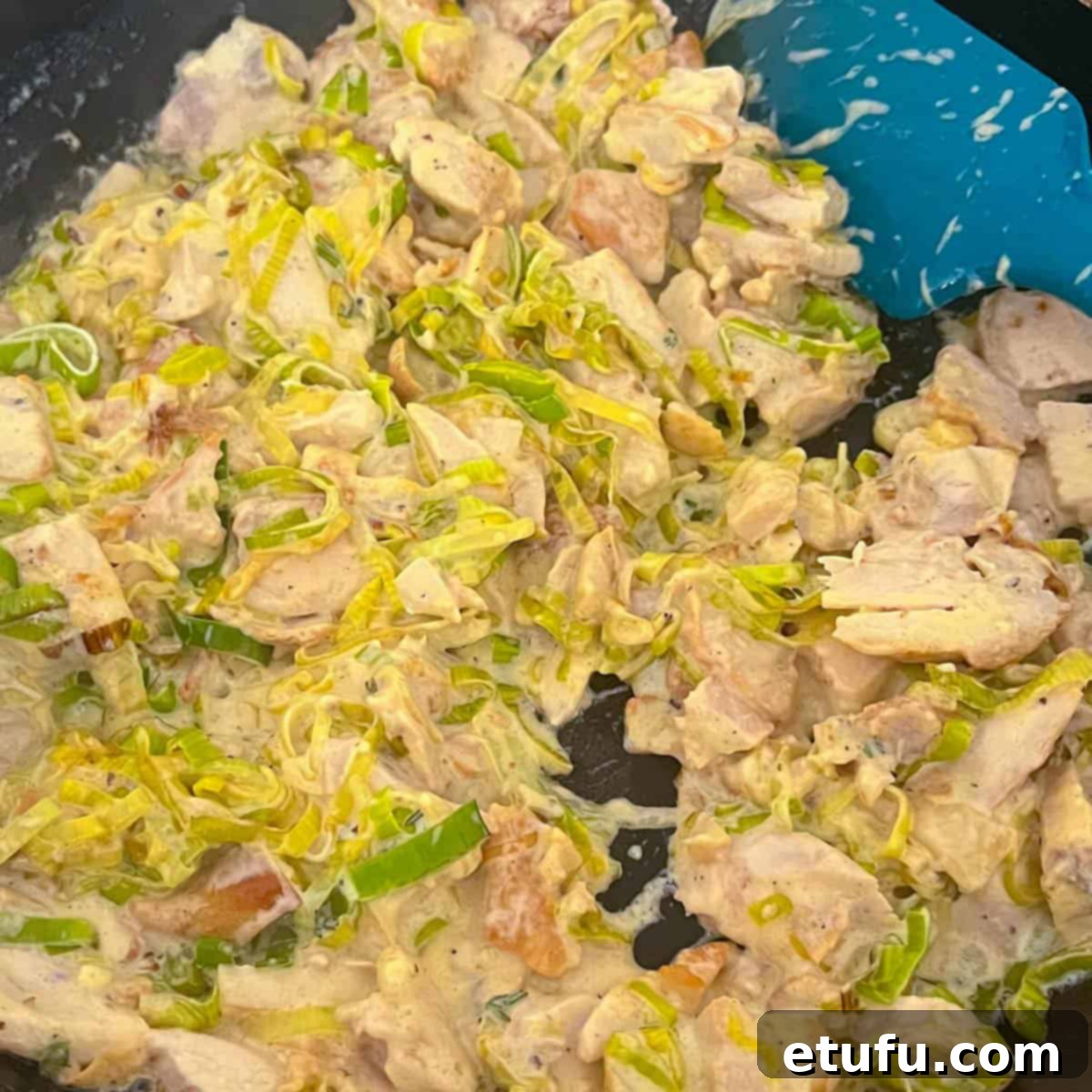 Golden Flaky Creamy Chicken Leek Pies 10 The finished creamy chicken and leek pie filling cooked in a pan, ready for assembly.