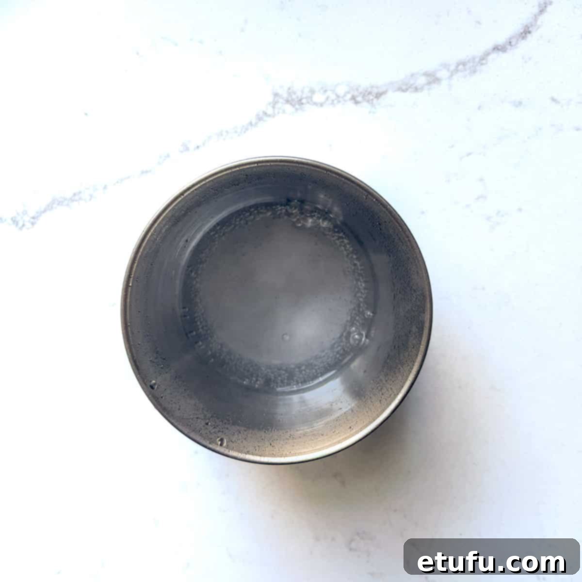 Bicarb and boiling water in a small stainless steel bowl.