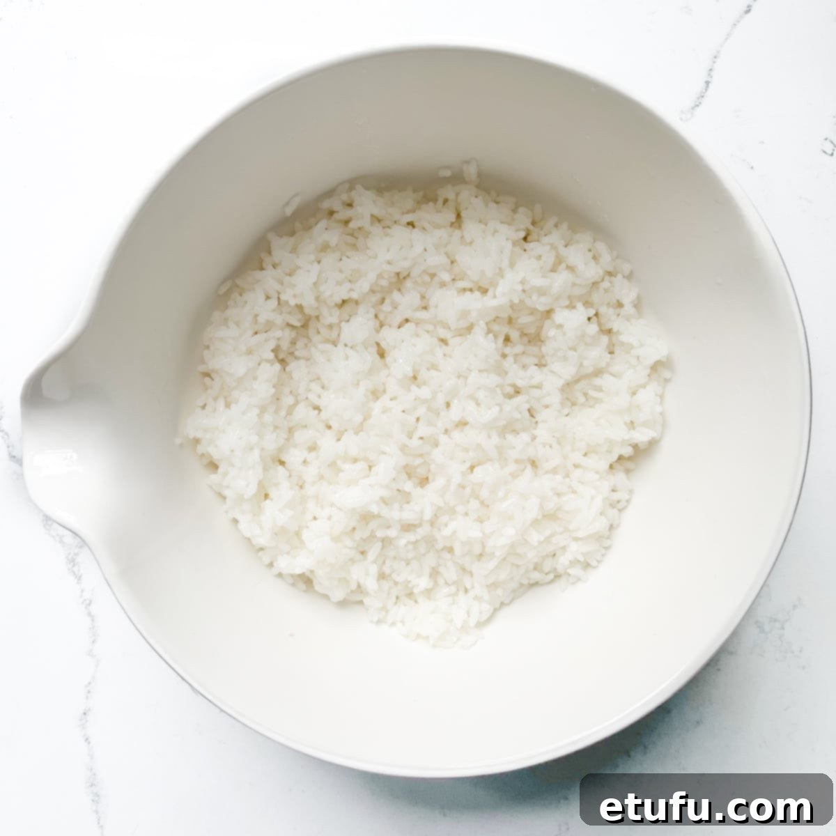 Cooked sushi rice in a bowl.
