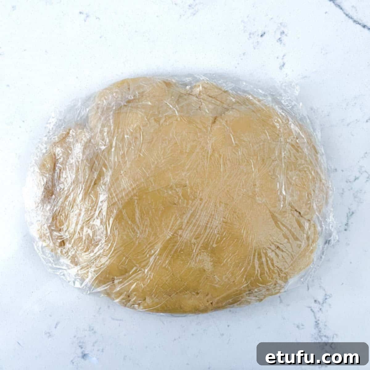 Exquisite French Fruit Tart 11 Pastry for the tarte aux fruit wrapped up in plastic film.