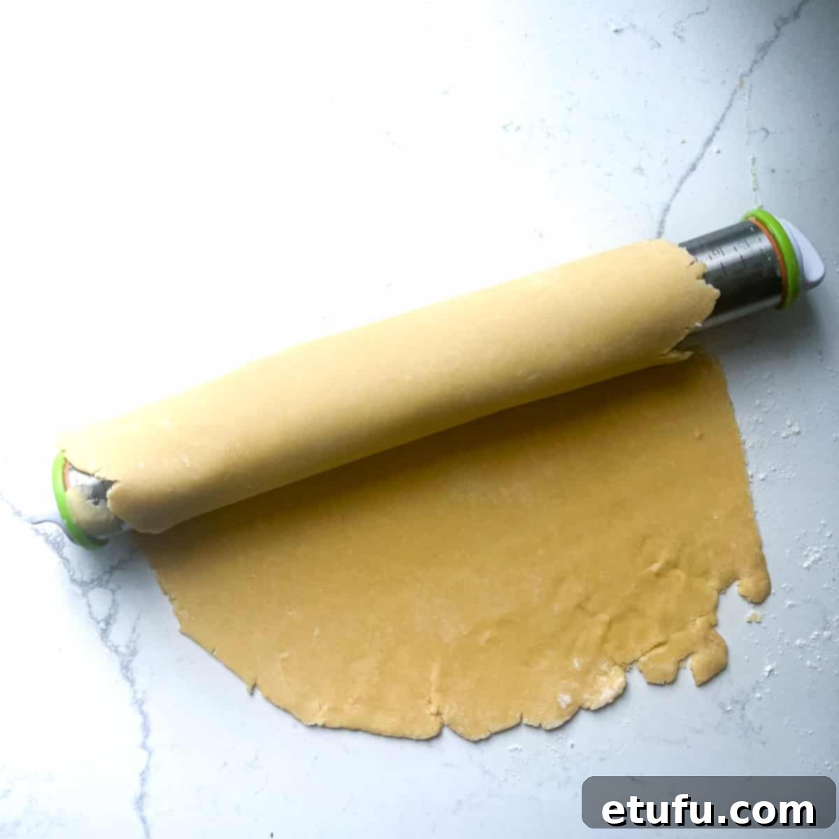 Exquisite French Fruit Tart 14 A sheet of pastry loosely wrapped around a rolling pin