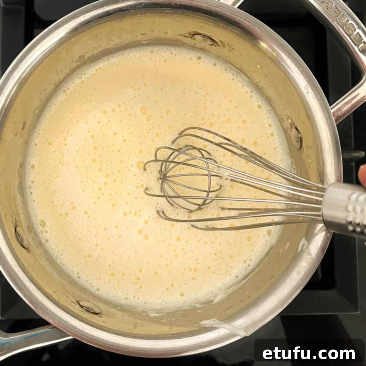 Exquisite French Fruit Tart 33 Heating the creme pattisiere mixture in a small saucepan.