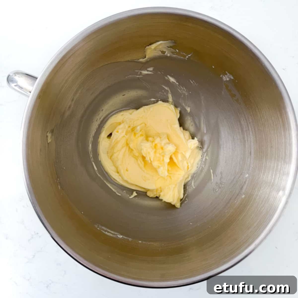 Exquisite French Fruit Tart 7 Mixed butter and sugar in the bowl of a stand mixer.