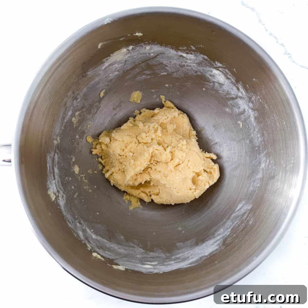 Exquisite French Fruit Tart 10 Pastry dough in the bowl of a stand mixer.