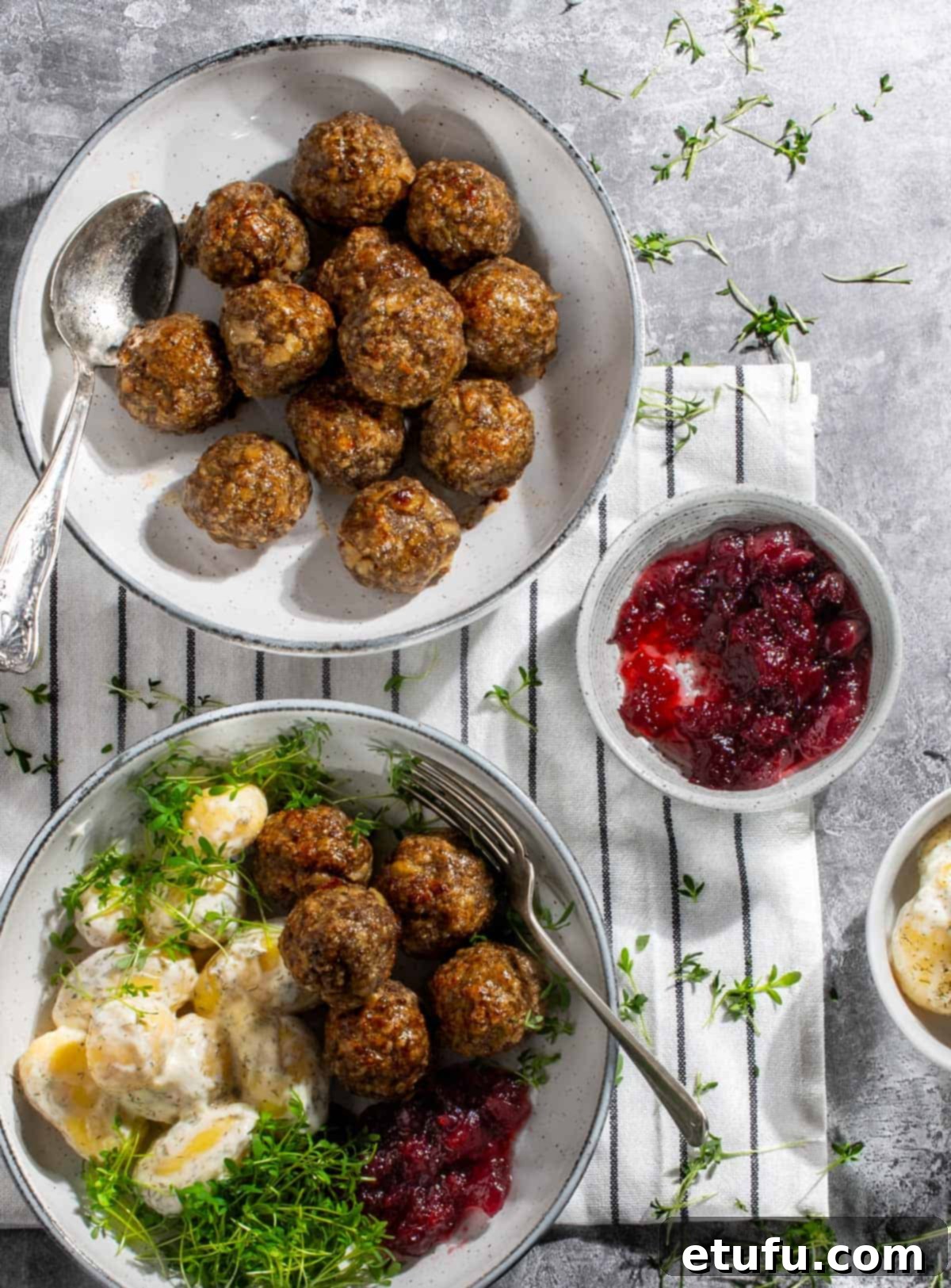 Lihapullat in a serving bowl along with a plate of meatballs and potato salad.