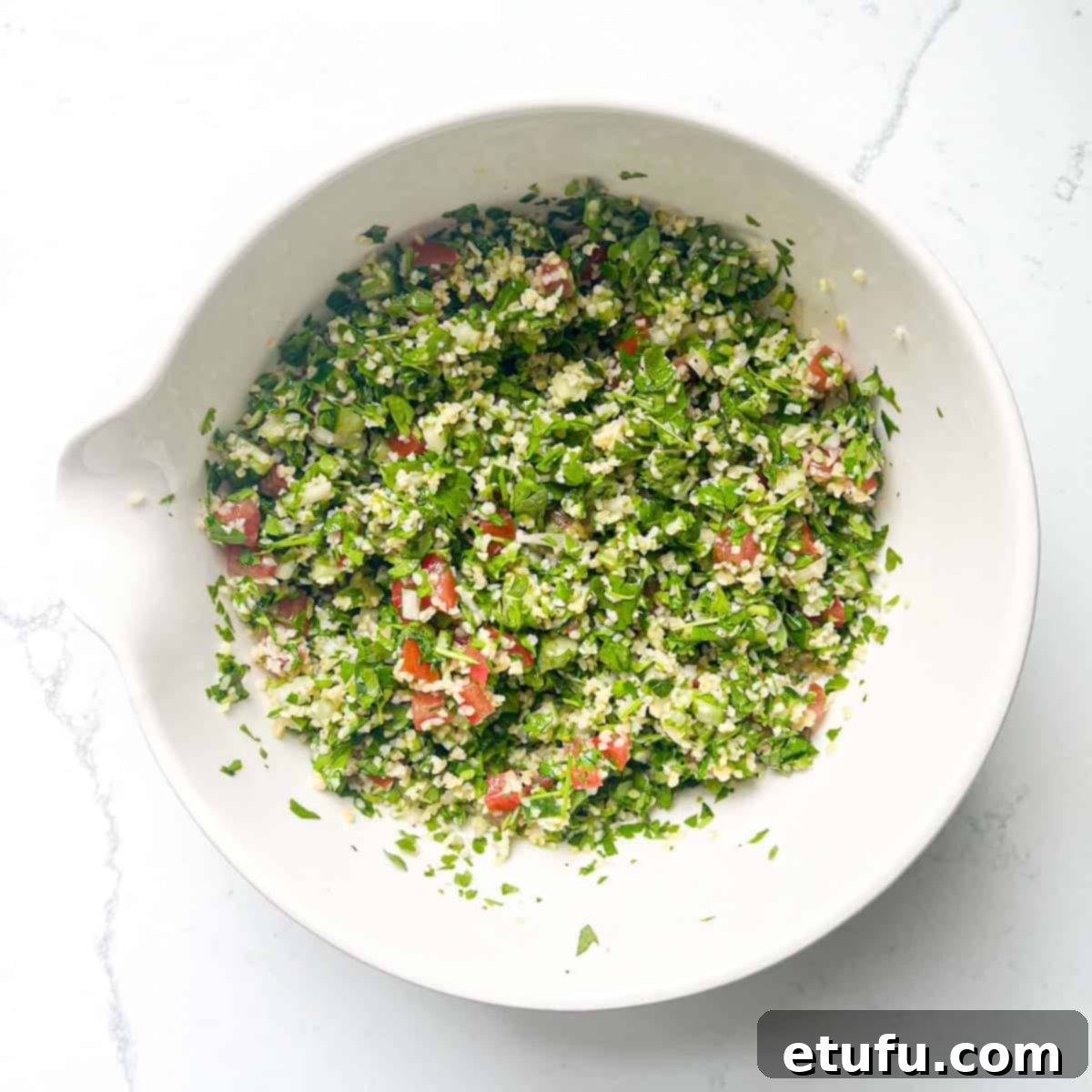Completed Taboule in a large white bowl.
