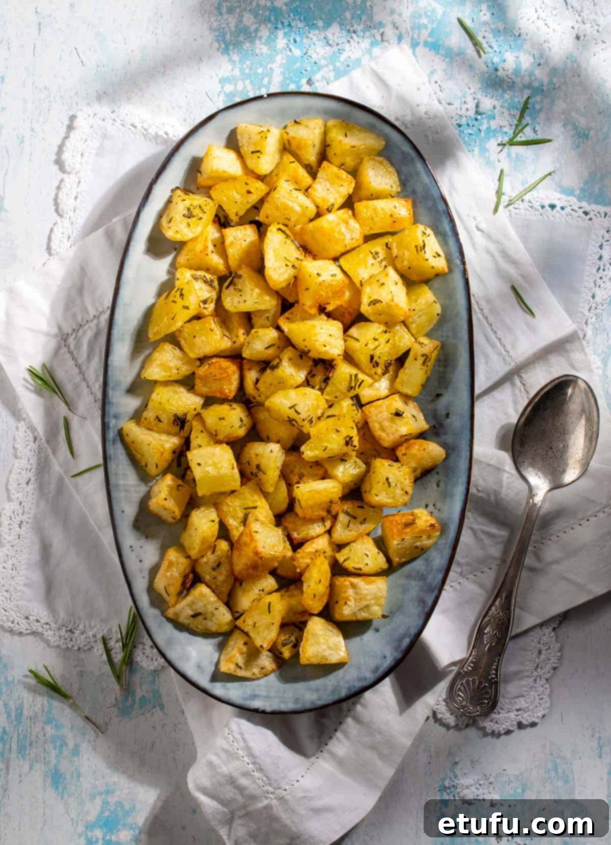 Parmentier potatoes in an oval dish on white napkins.