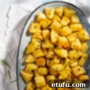 Parmentier potatoes in an oval dish on white napkins.