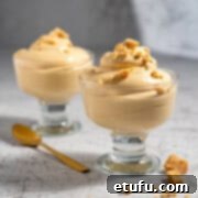Two portions of dulce de leche mousse in elegant parfait glasses, garnished lightly.
