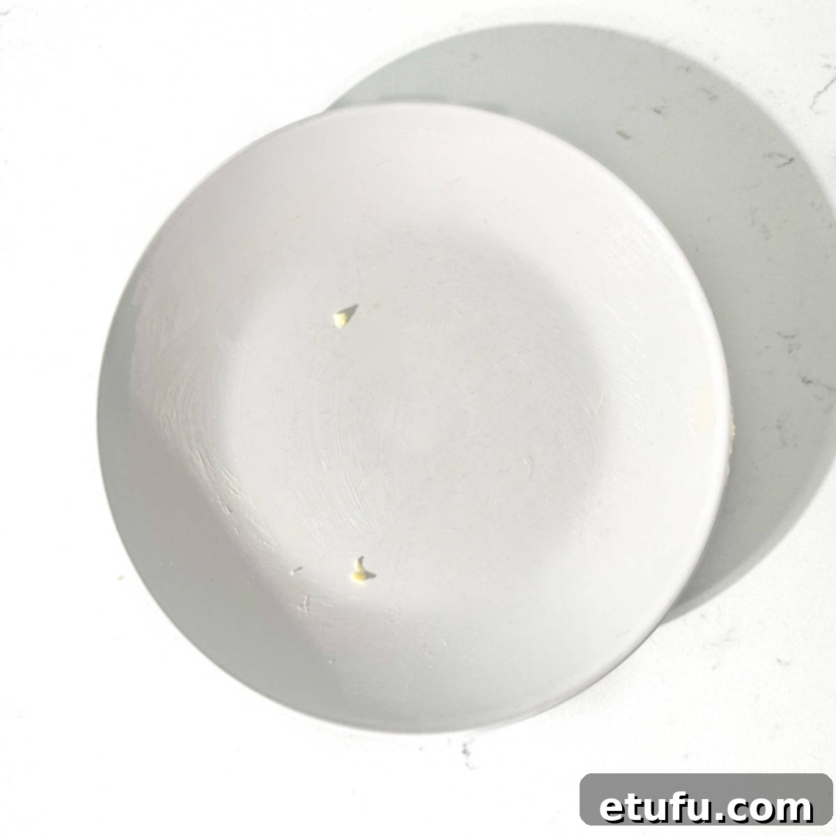 A white buttered plate. 