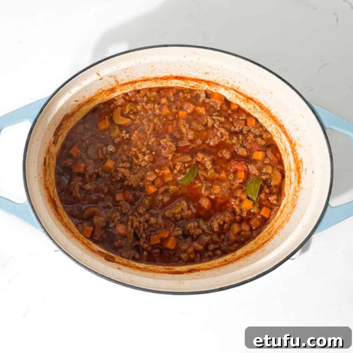 Mince for the mince and dumpling recipe cooked in a large pot.