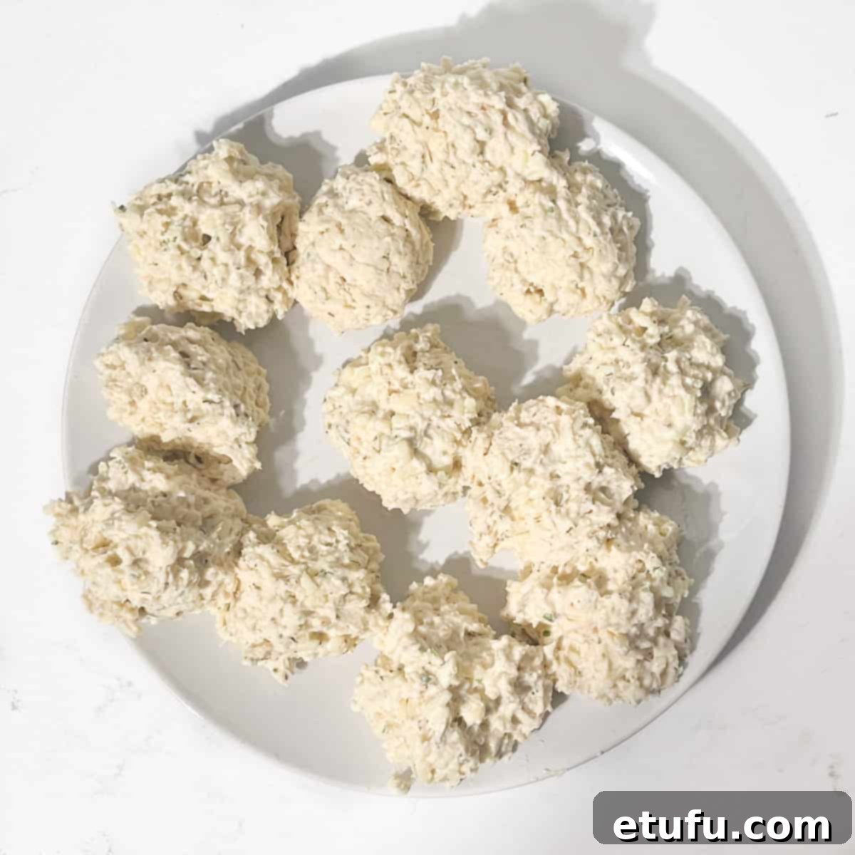 Rolled dumplings on a plate.