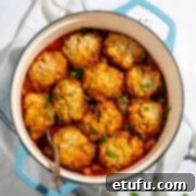 Mince and dumplings in a blue cast iron pot.