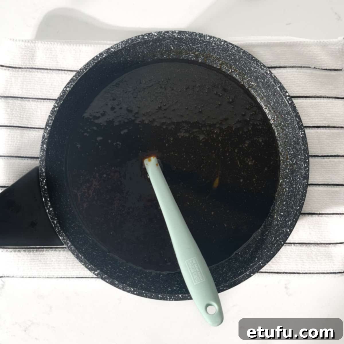 Melting the butter, sugars and syrups in a small saucepan.