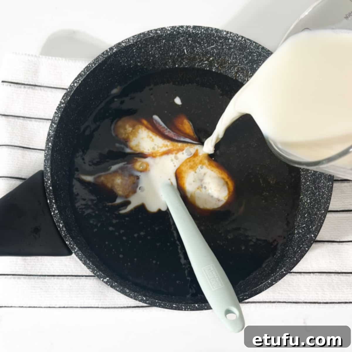 Pouring milk into the pan of melted liquids.