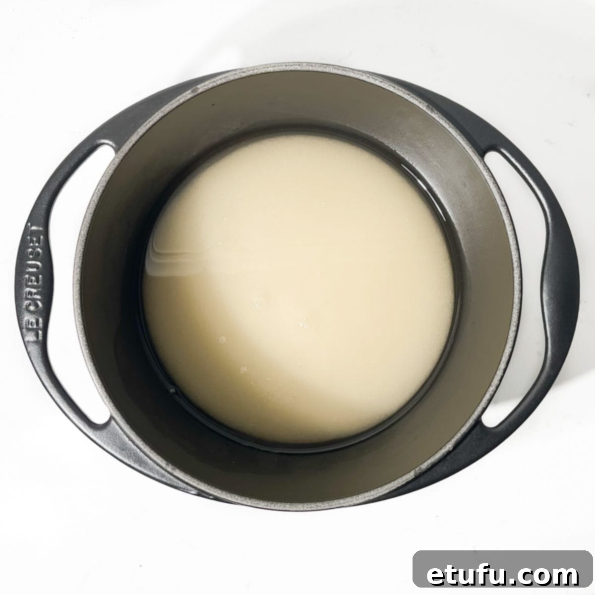 White wine vinegar and sugar in a saucepan.