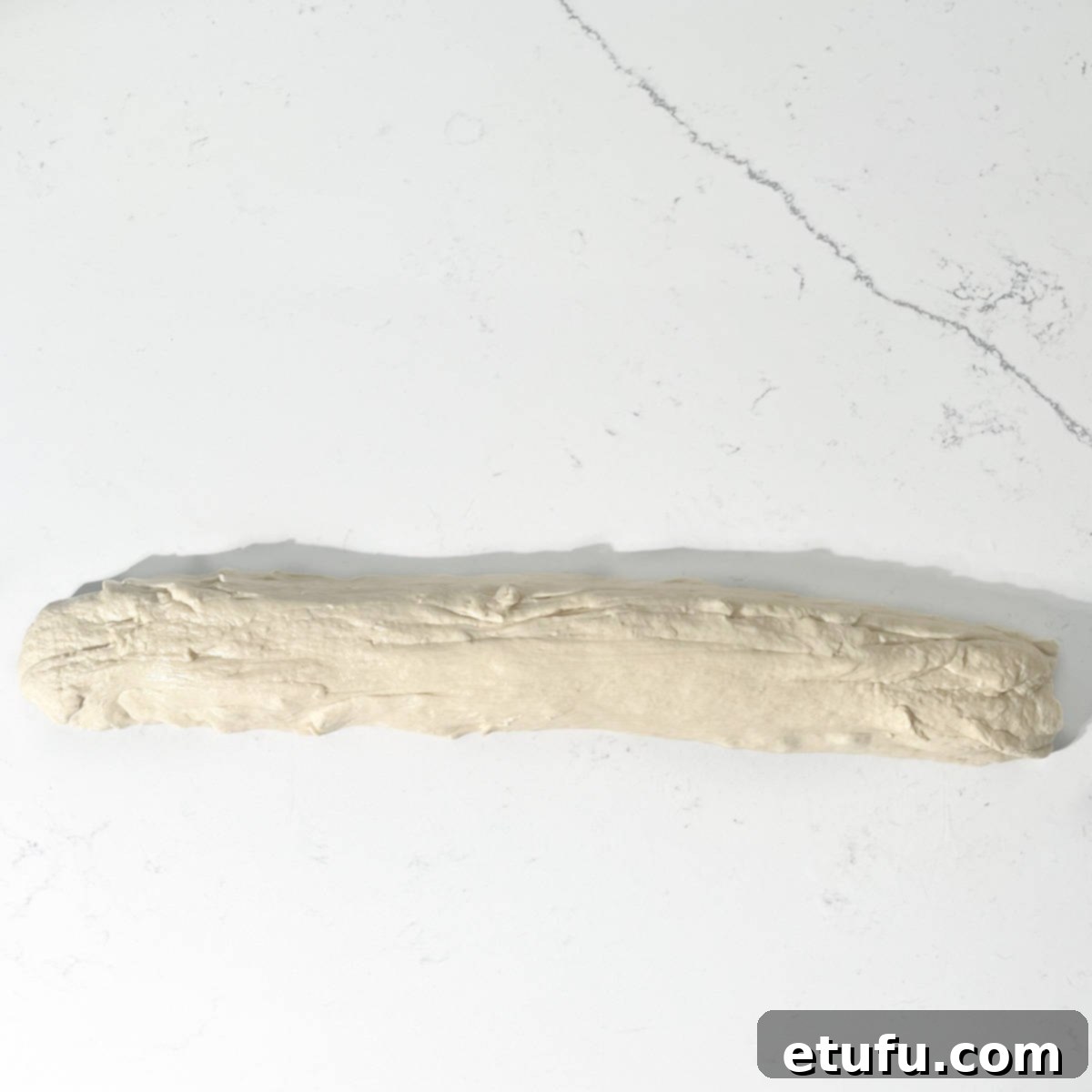 A long sausage-shaped piece of dough.