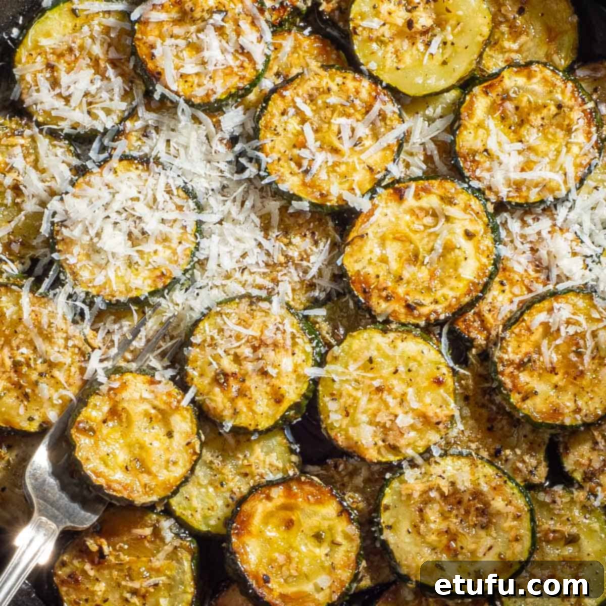 Crispy Fried Zucchini 12 Finished fried courgettes with Parmesan, salt, pepper, herbs, and lemon juice.