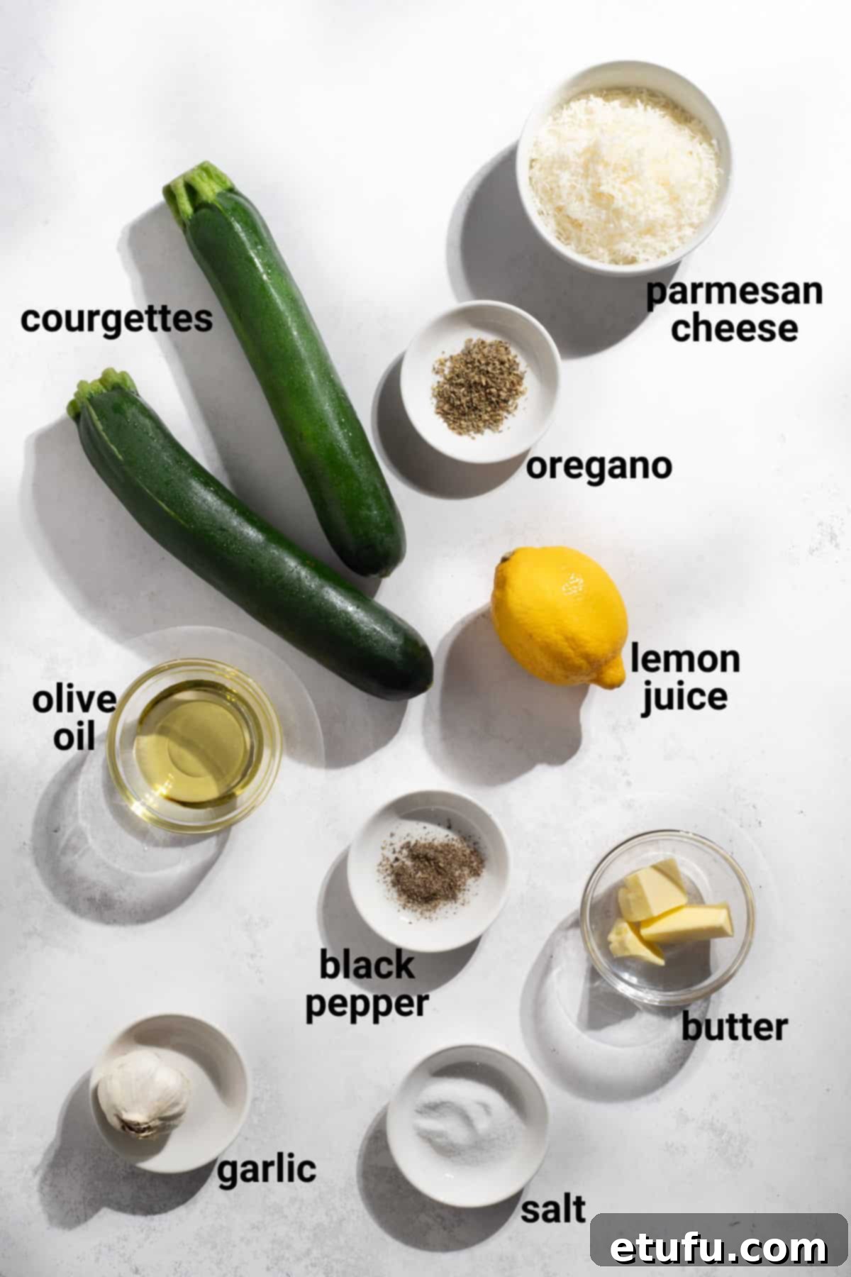 Crispy Fried Zucchini 3 Fried courgettes ingredients laid out on a wooden board.