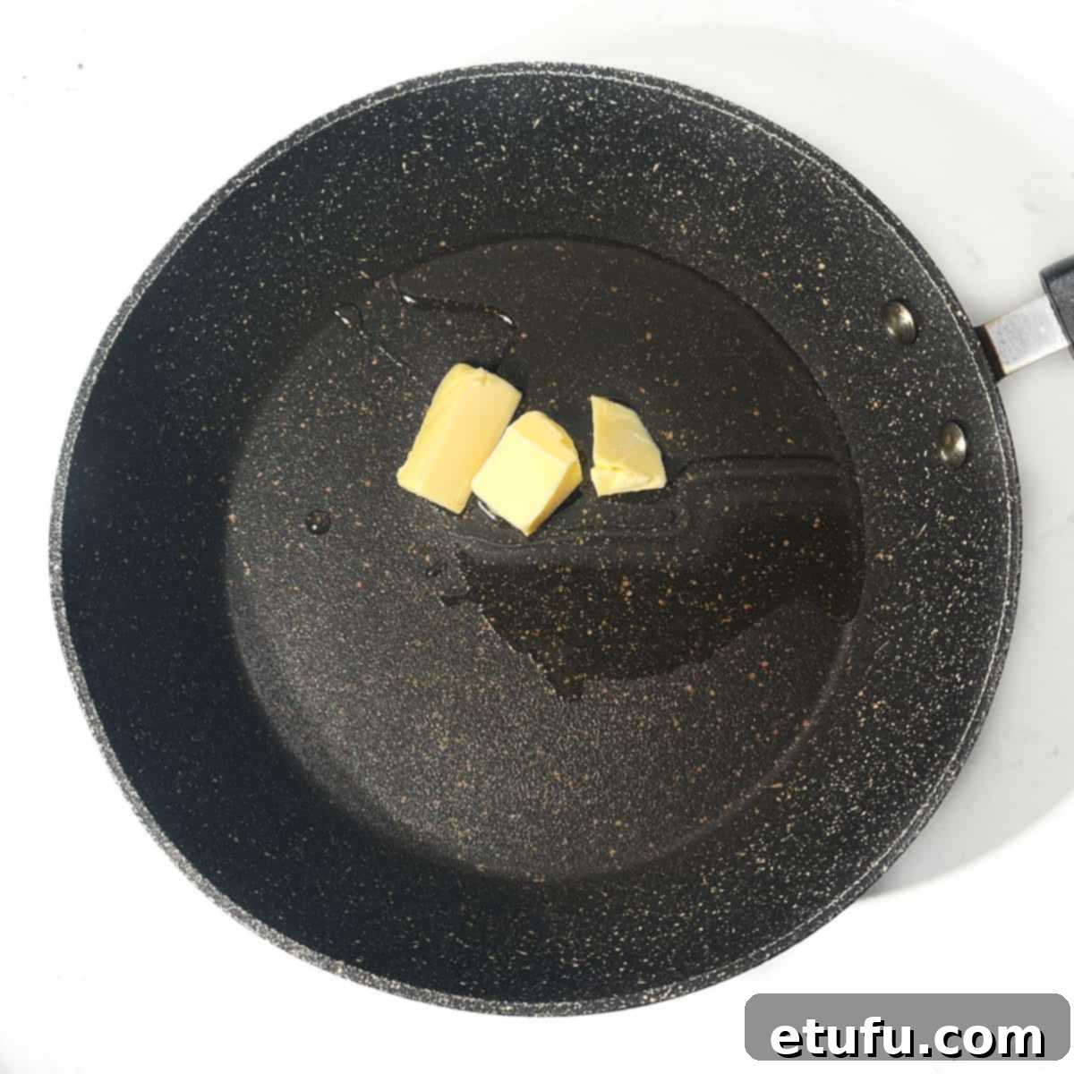 Crispy Fried Zucchini 5 Adding butter and olive oil to a large frying pan.