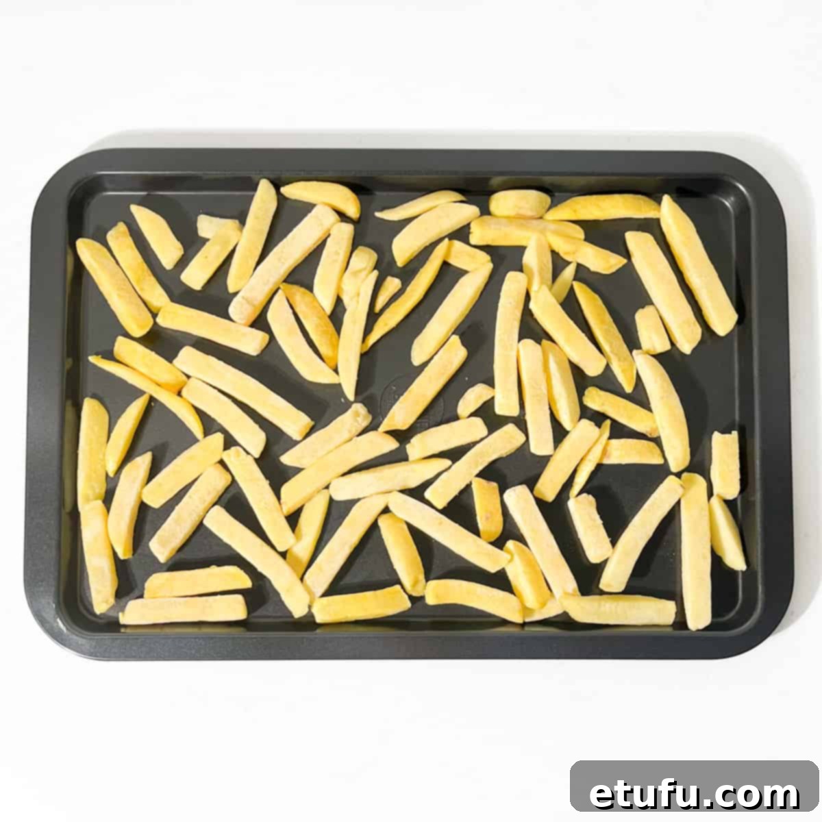 Oven chips on a baking tray. 