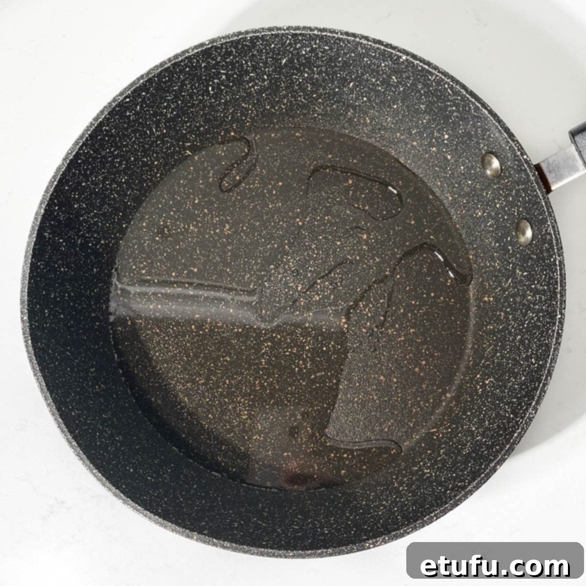 Oil in a frying pan.