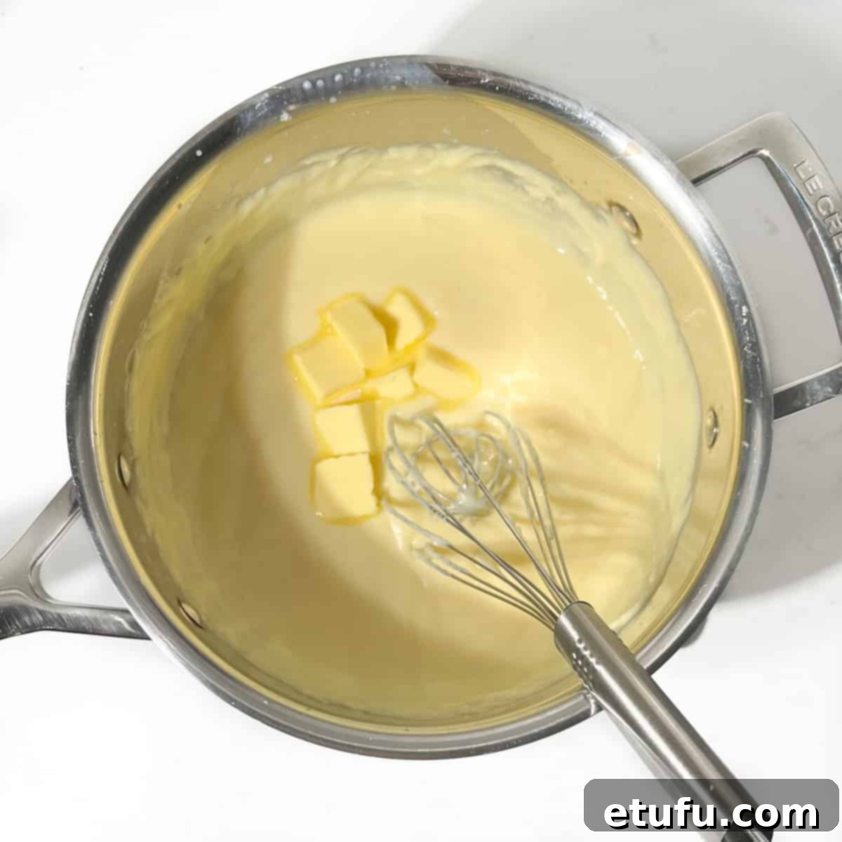 Butter being whisked into the Crème Pâtissière.