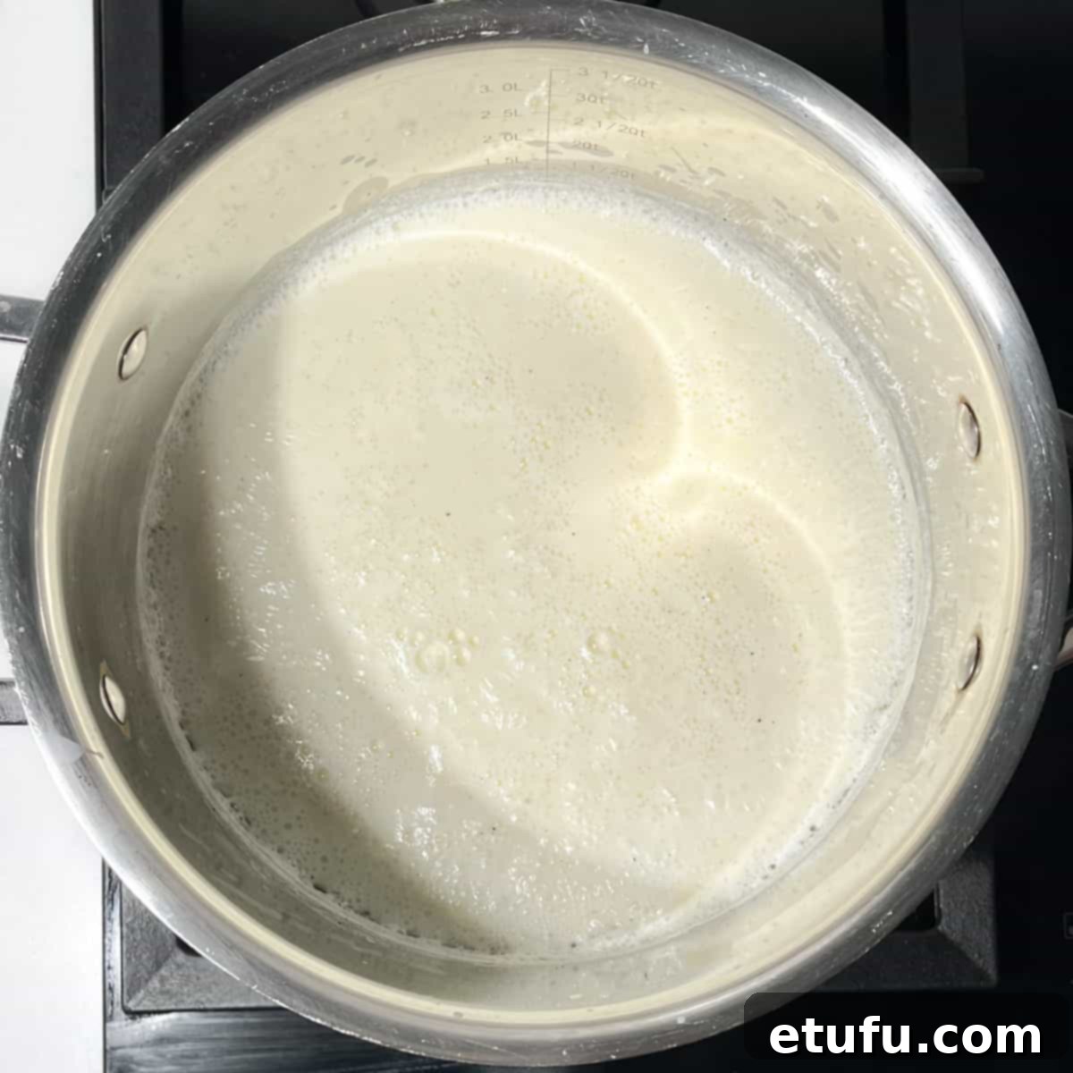 Boiling milk in a saucepan.