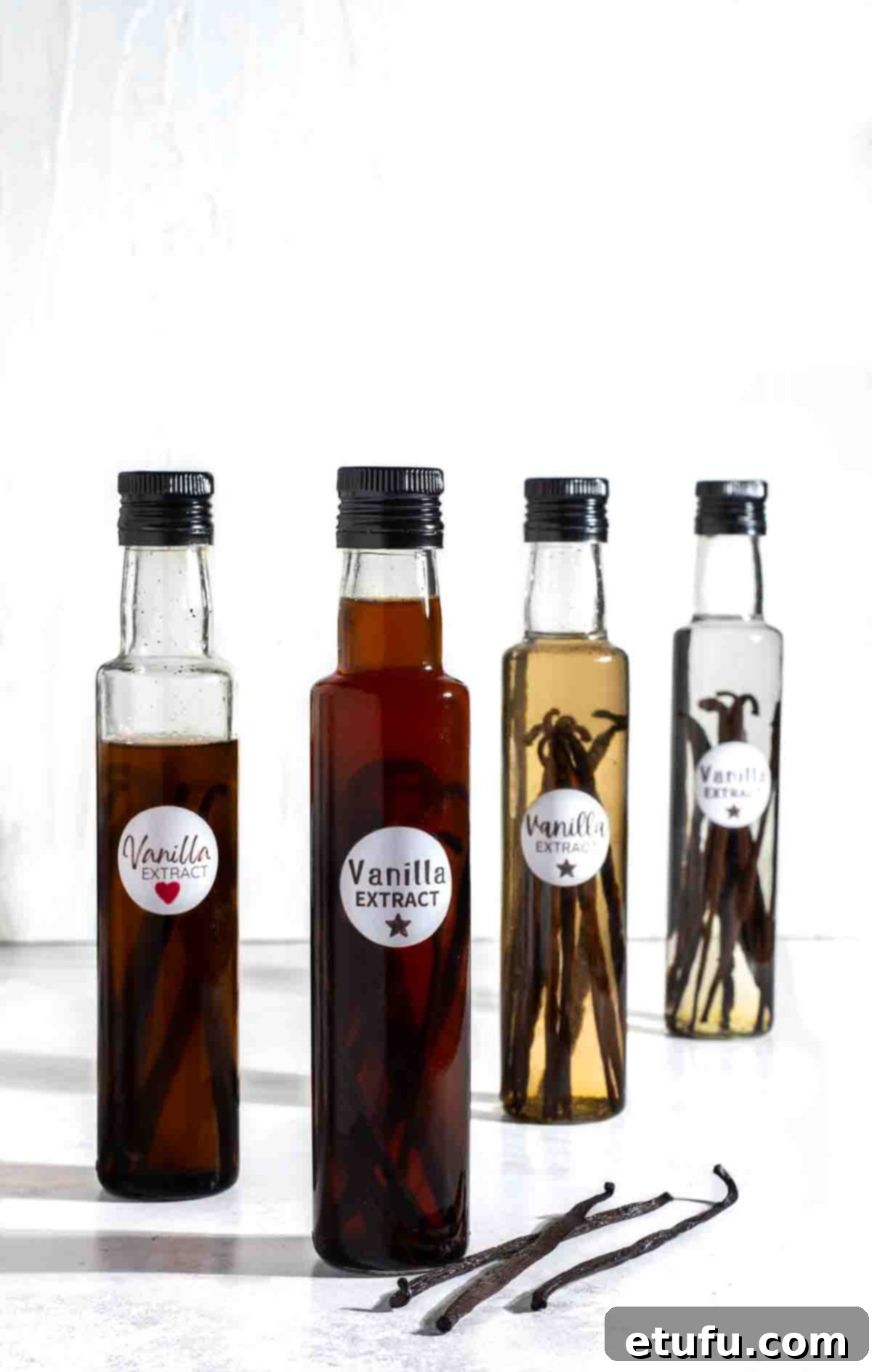 Homemade vanilla extract bottle on a white background.