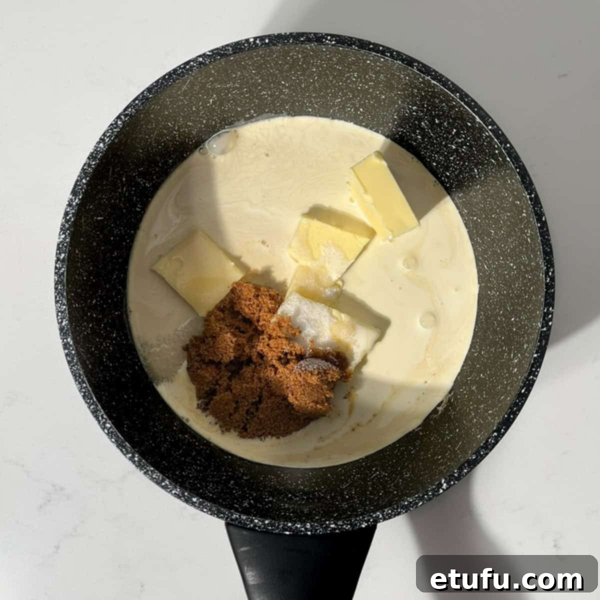 Sticky South African Malva Delight 12 Making the cream sauce for the malva pudding recipe.