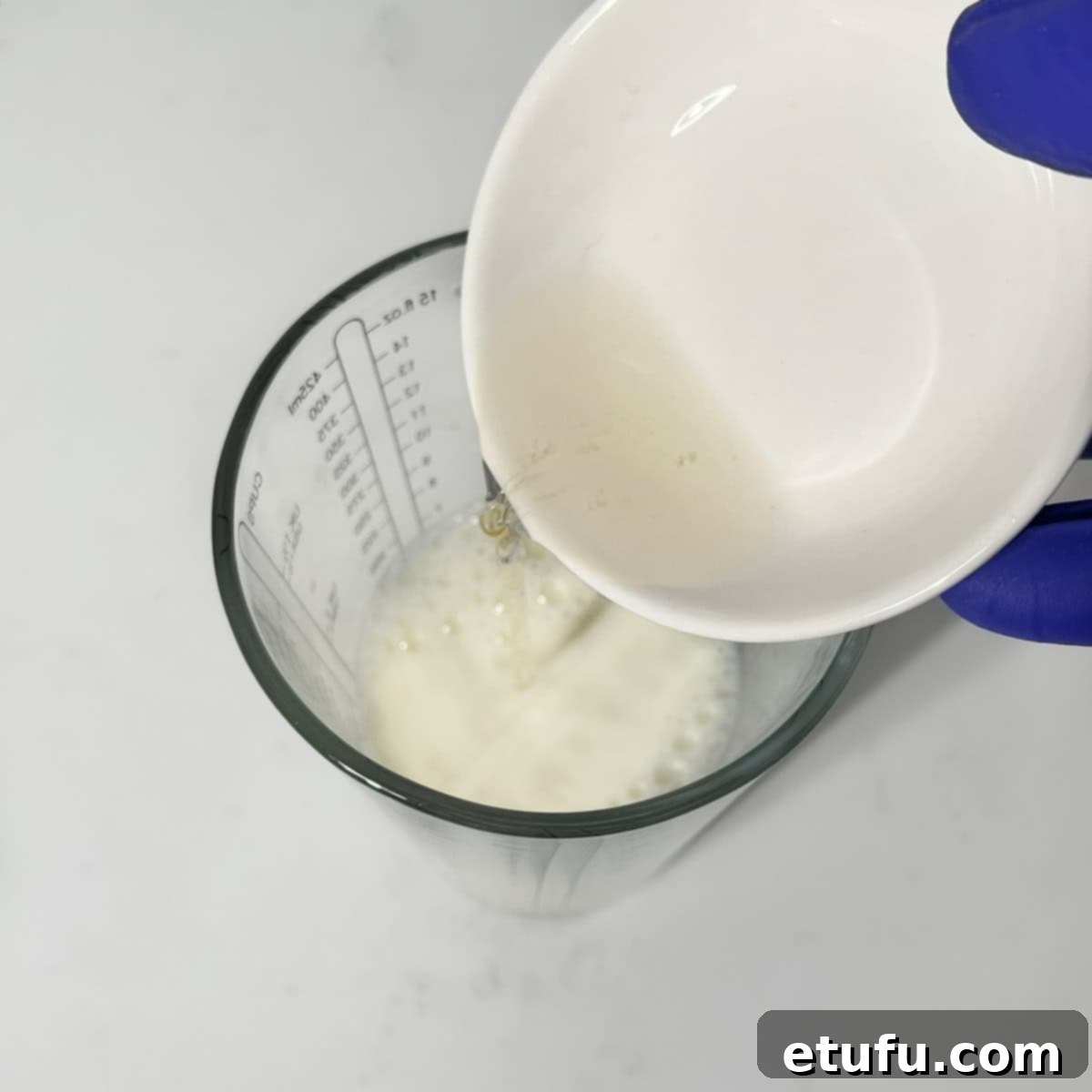 Sticky South African Malva Delight 5 Adding vinegar to milk in a measuring jug.