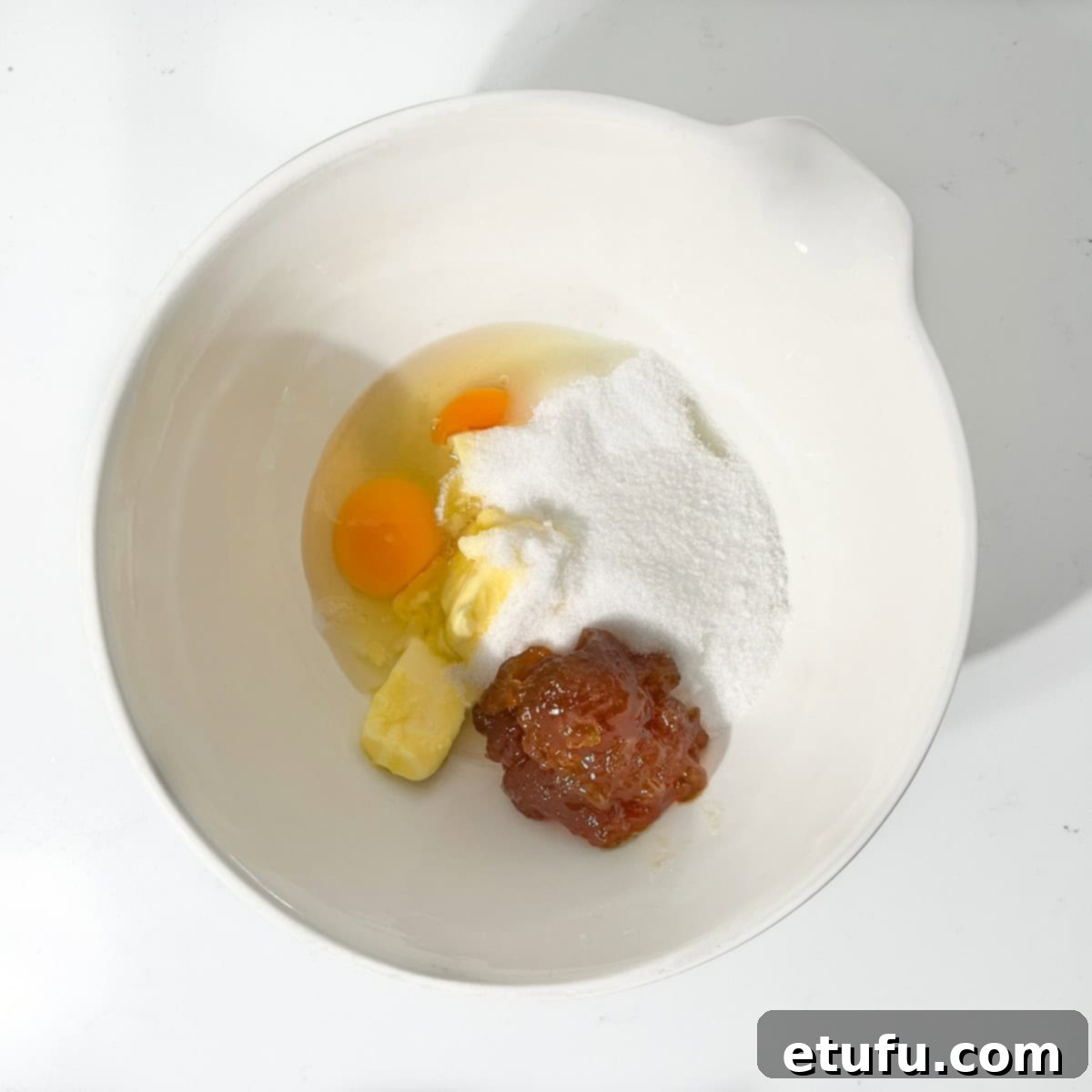 Sticky South African Malva Delight 6 Adding eggs, sugars and butter to a large mixing bowl.