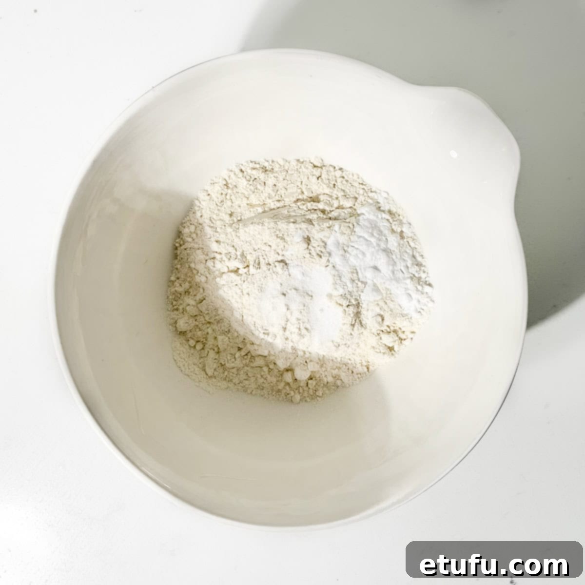 Sticky South African Malva Delight 9 Mixing the dry ingredients for the south african malva pudding.